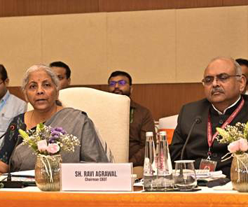 Ravi Agrawal delivering a speech on tax reform